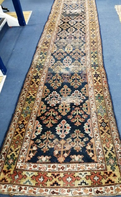 A Caucasian blue ground runner 410 x 97cm (a.f.)